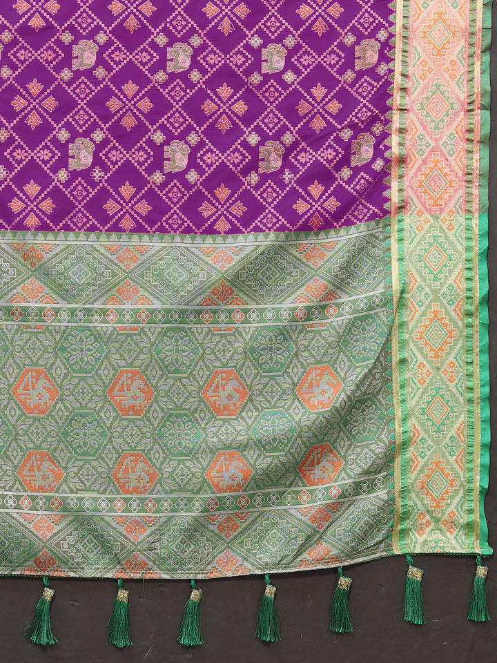 Rich purple Patola silk sari with stunning pallu and elegant zari, ideal for Indian ceremonies.