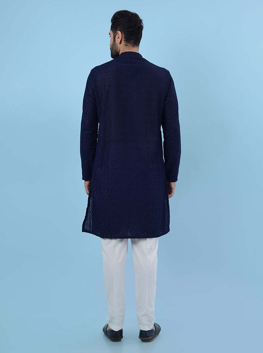 Men's navy blue kurta pajama set, featuring intricate embroidery for a traditional look.