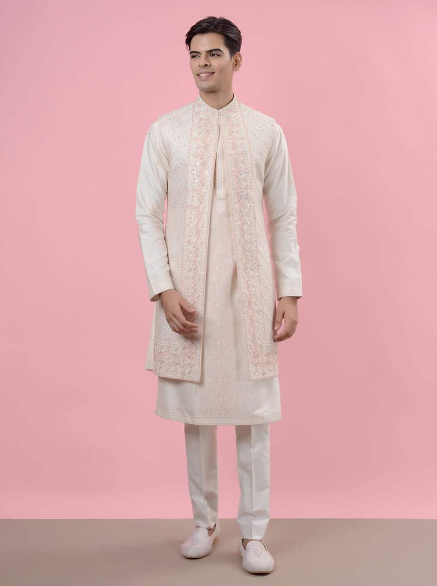 Luxurious Cream & Peach Sherwani with detailed craftsmanship, ideal for modern wedding celebrations.