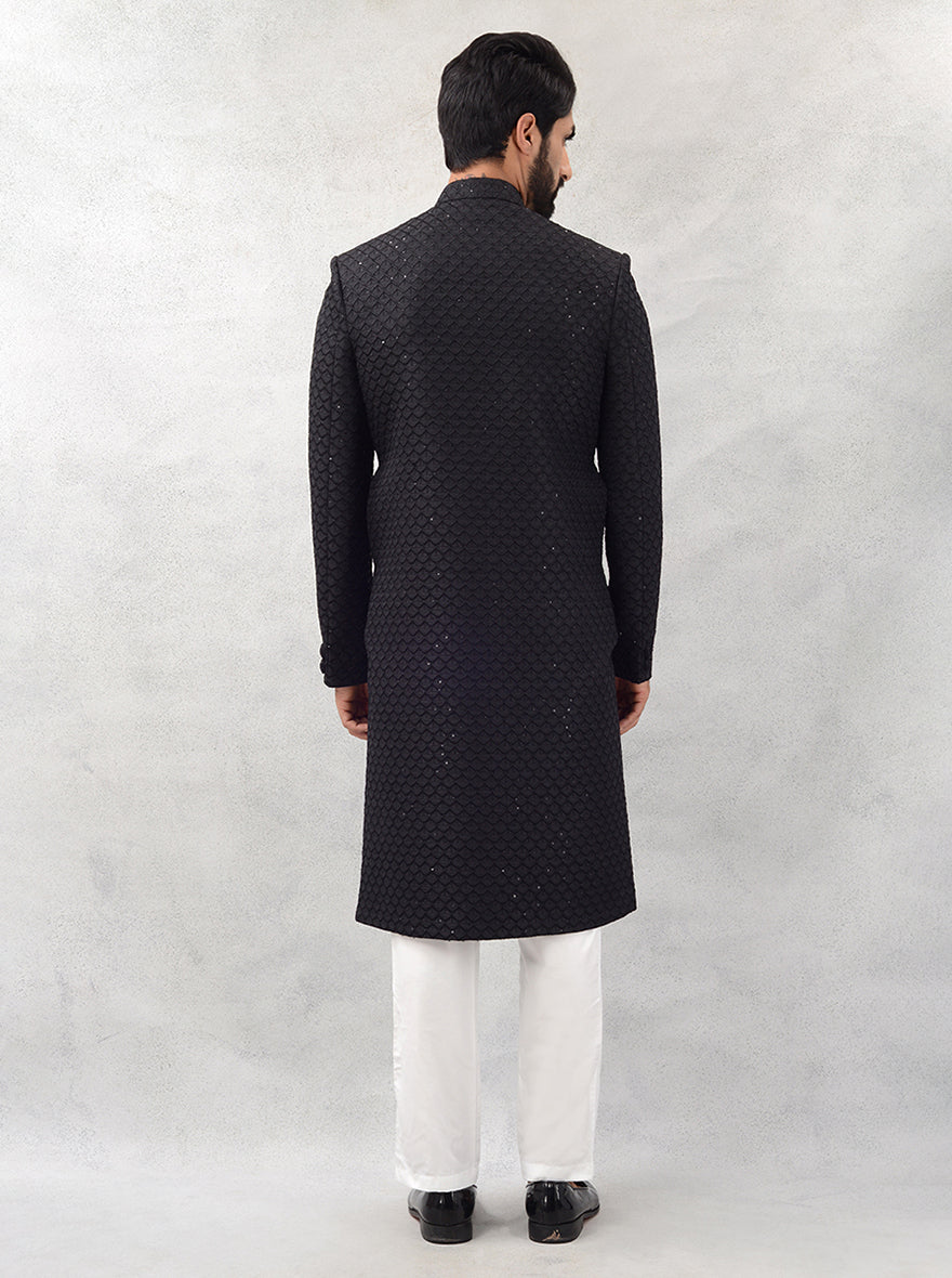 Experience refined elegance with this black sherwani, perfect for grooms looking to elevate their wedding attire with a touch of modern style.