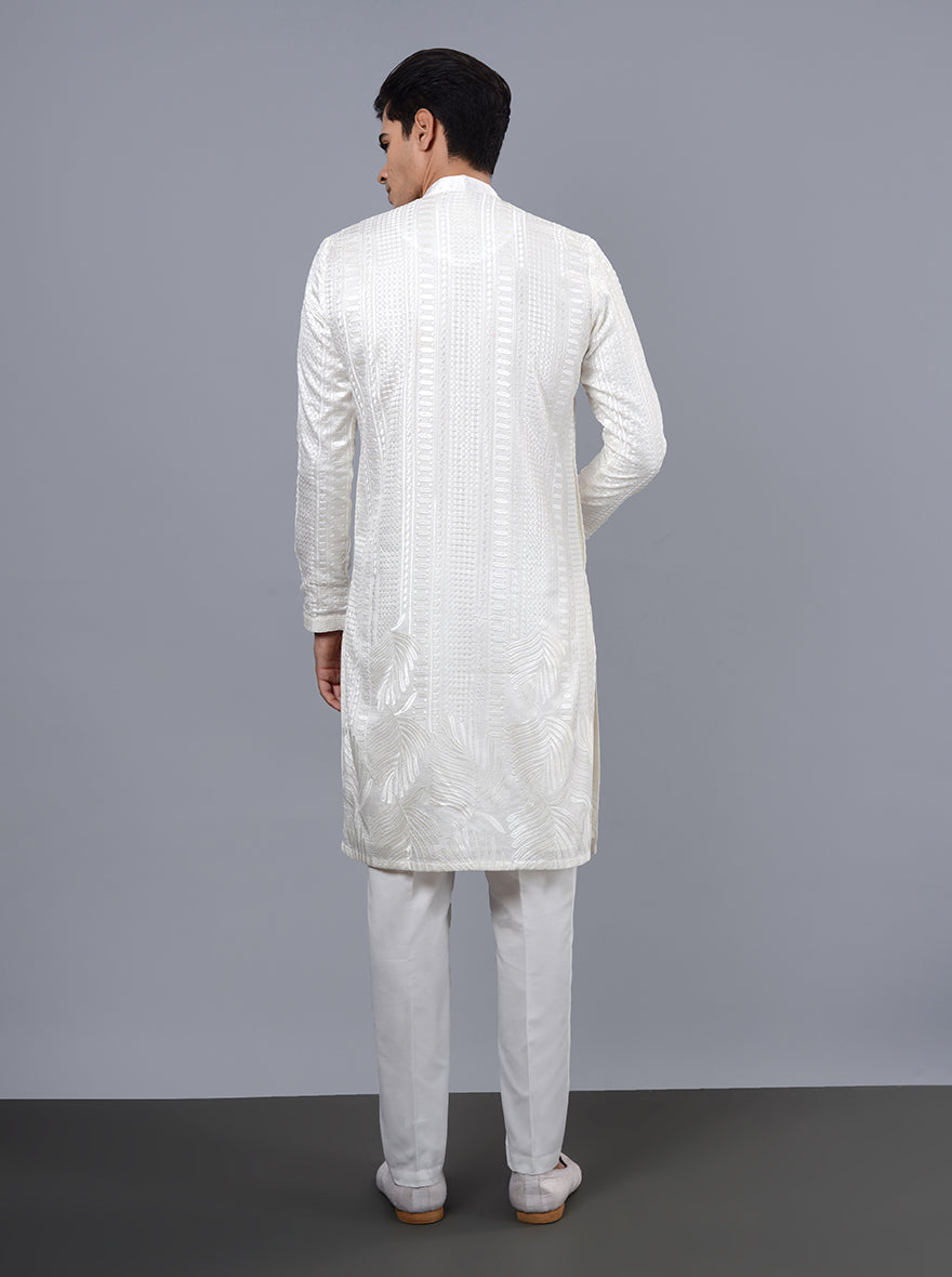 White silk blend kurta pajama featuring stunning embroidery, perfect for adding elegance to your festive wardrobe.