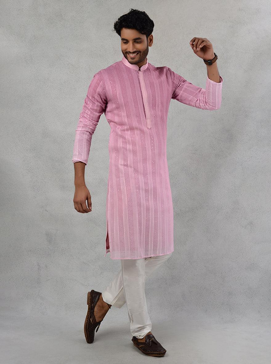 Elevate your festive wardrobe with this exquisite pink kurta pajama, designed for modern men.