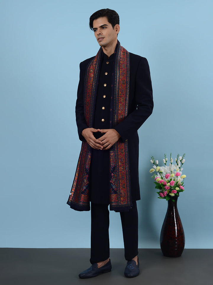 Shine at weddings in the USA wearing this navy blue Indo Western, made from premium fabric with stunning embroidery details.