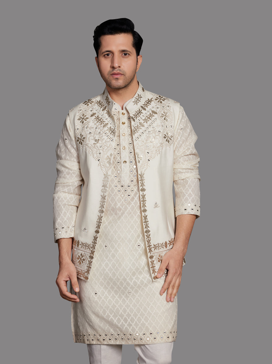 Men’s cream kurta pajama set with silk blend fabric and embroidered koti.