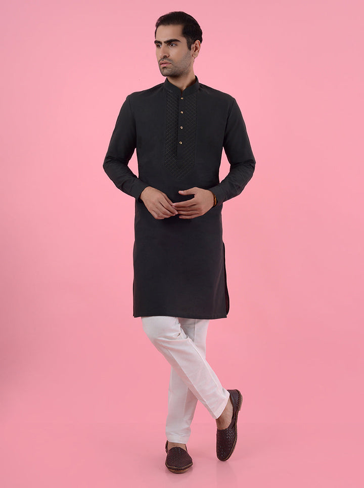 Comfortable dark green cotton blend kurta pajama set with elegant yoke embroidery for men.