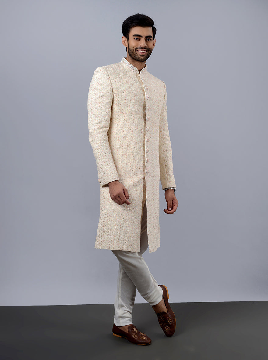 Stylish cream sherwani for grooms, blending tradition and modern design for special occasions.