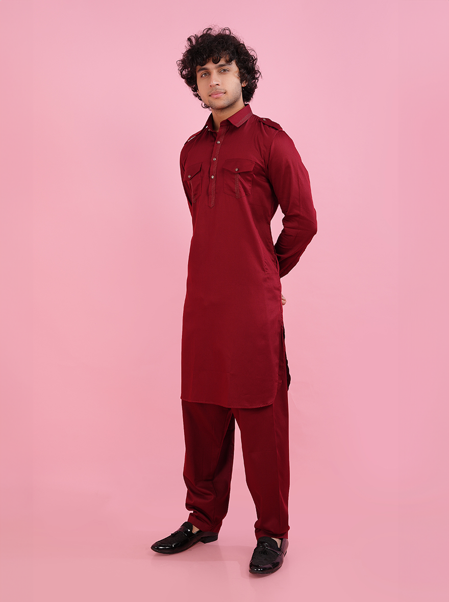 This luxurious maroon Pathani kurta showcases beautiful thread detailing and full sleeves, making it a perfect choice for cultural events and special occasions.