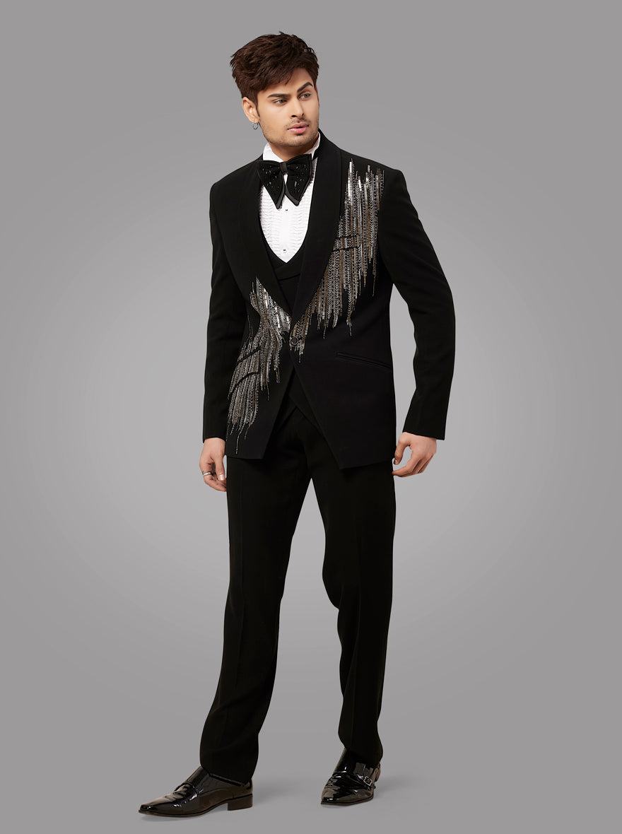 Black tuxedo suit designed for comfort and style, featuring luxurious fabric and beautiful embroidery for special occasions.