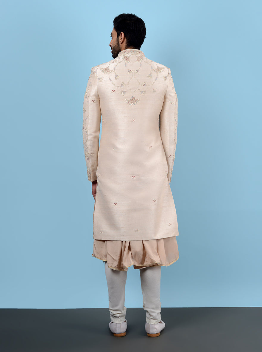 Luxurious fawn peach sherwani with detailed embroidery, ideal for special occasions and weddings.