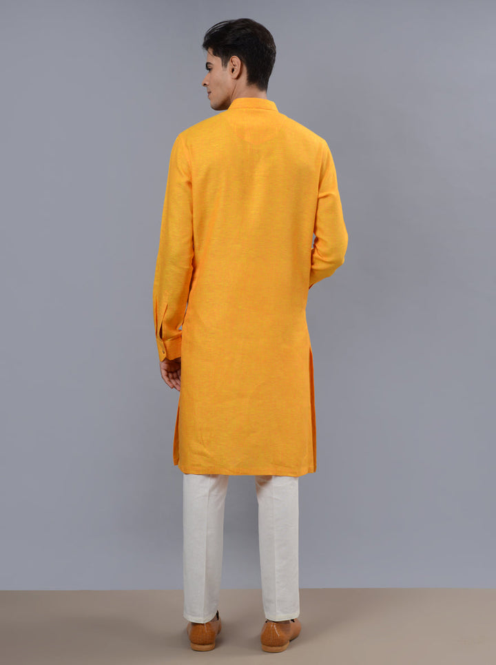 Celebrate in vibrant style with our orange & yellow kurta pajama, tailored for festive occasions.