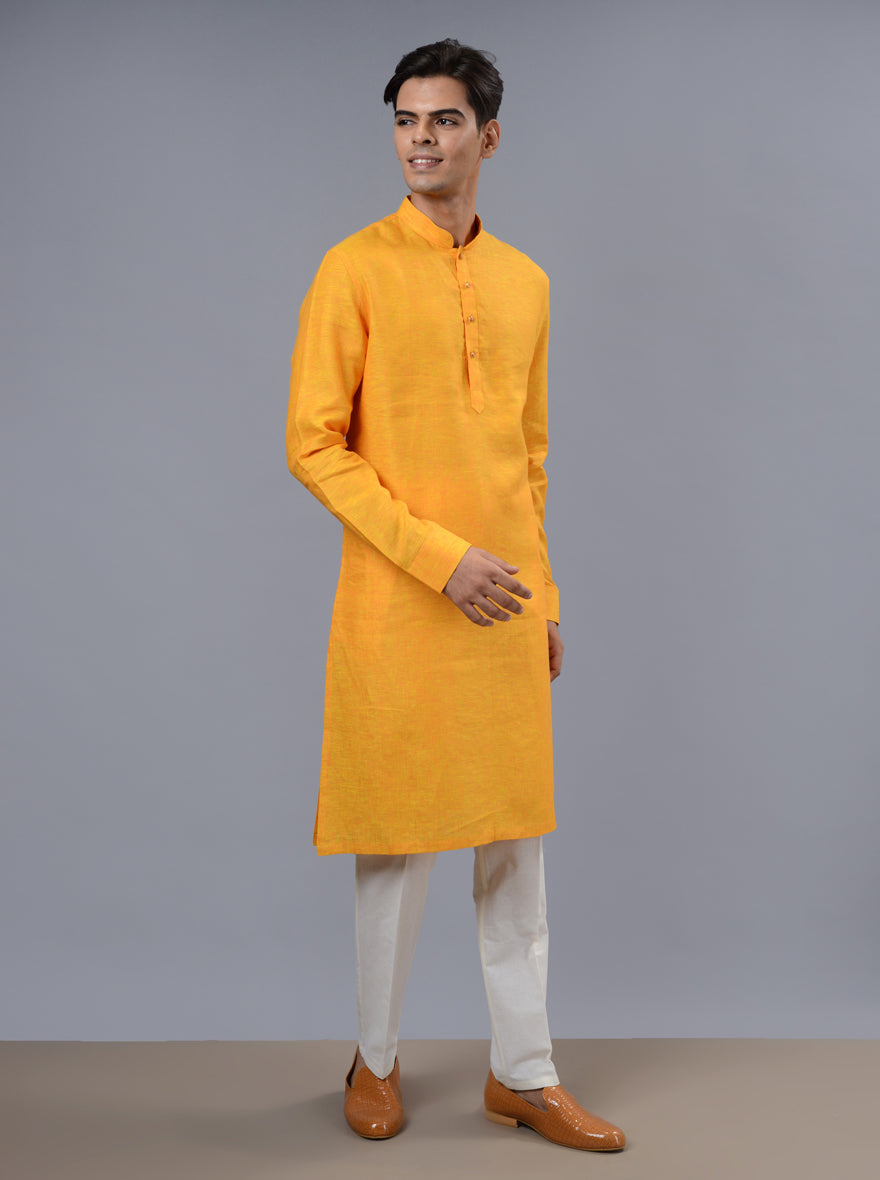 Perfect for traditional celebrations, our orange & yellow kurta pajama adds flair to your wardrobe.