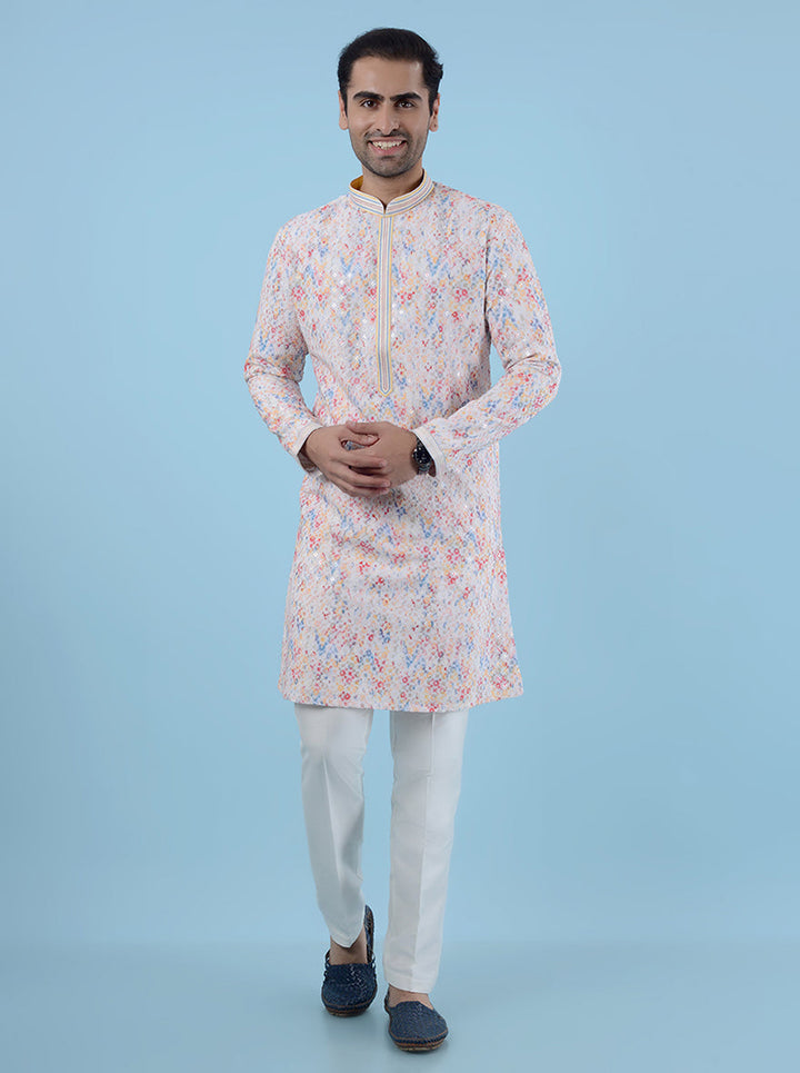 Stylish white silk blend kurta pajama for men, designed with delicate embroidery for cultural events.