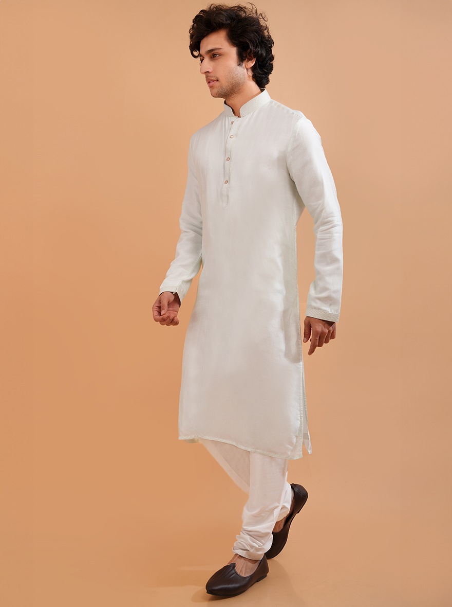 Discover the intricate details of this mint green kurta pajama, ideal for festive celebrations in the USA.