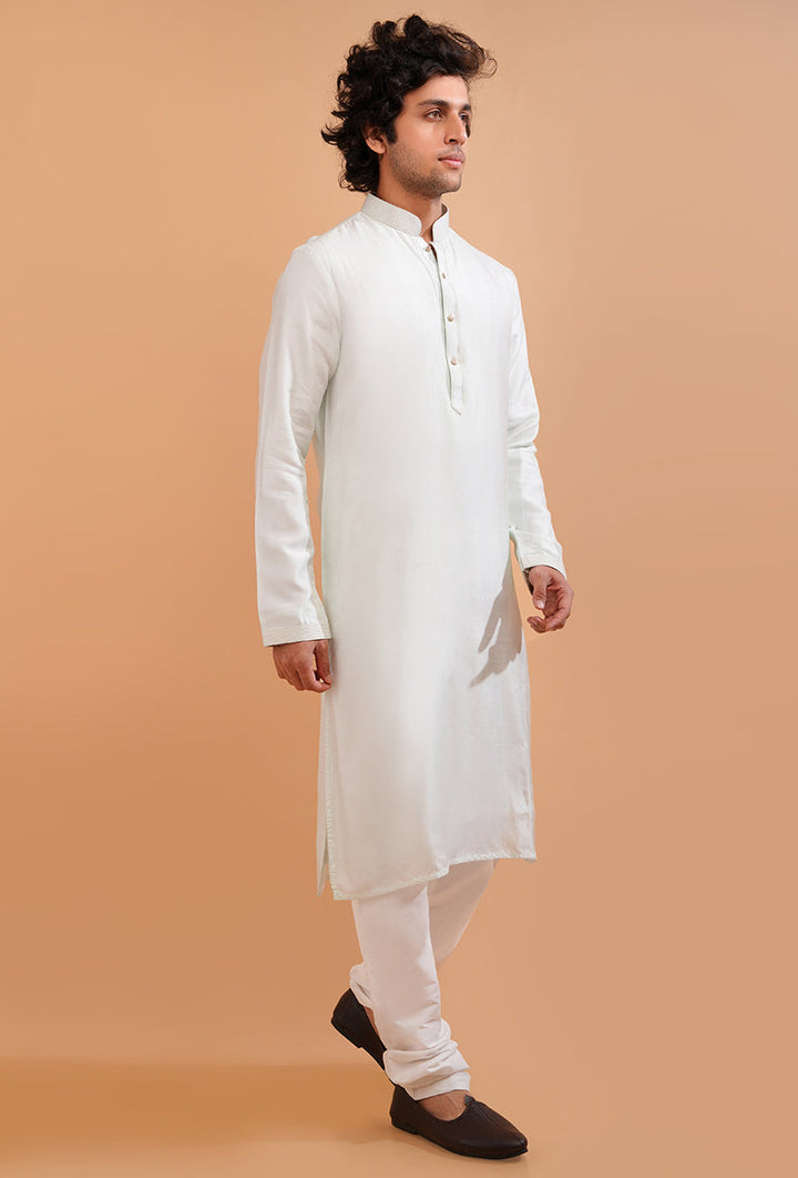 Enjoy the luxurious feel of this mint green silk blend kurta pajama, perfect for any ethnic gathering in the USA.