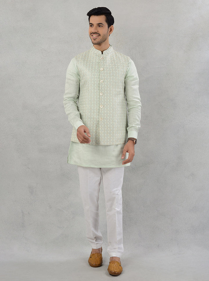 Stylish Pista Green Kurta Set featuring intricate embroidery, made from breathable linen for festive occasions.