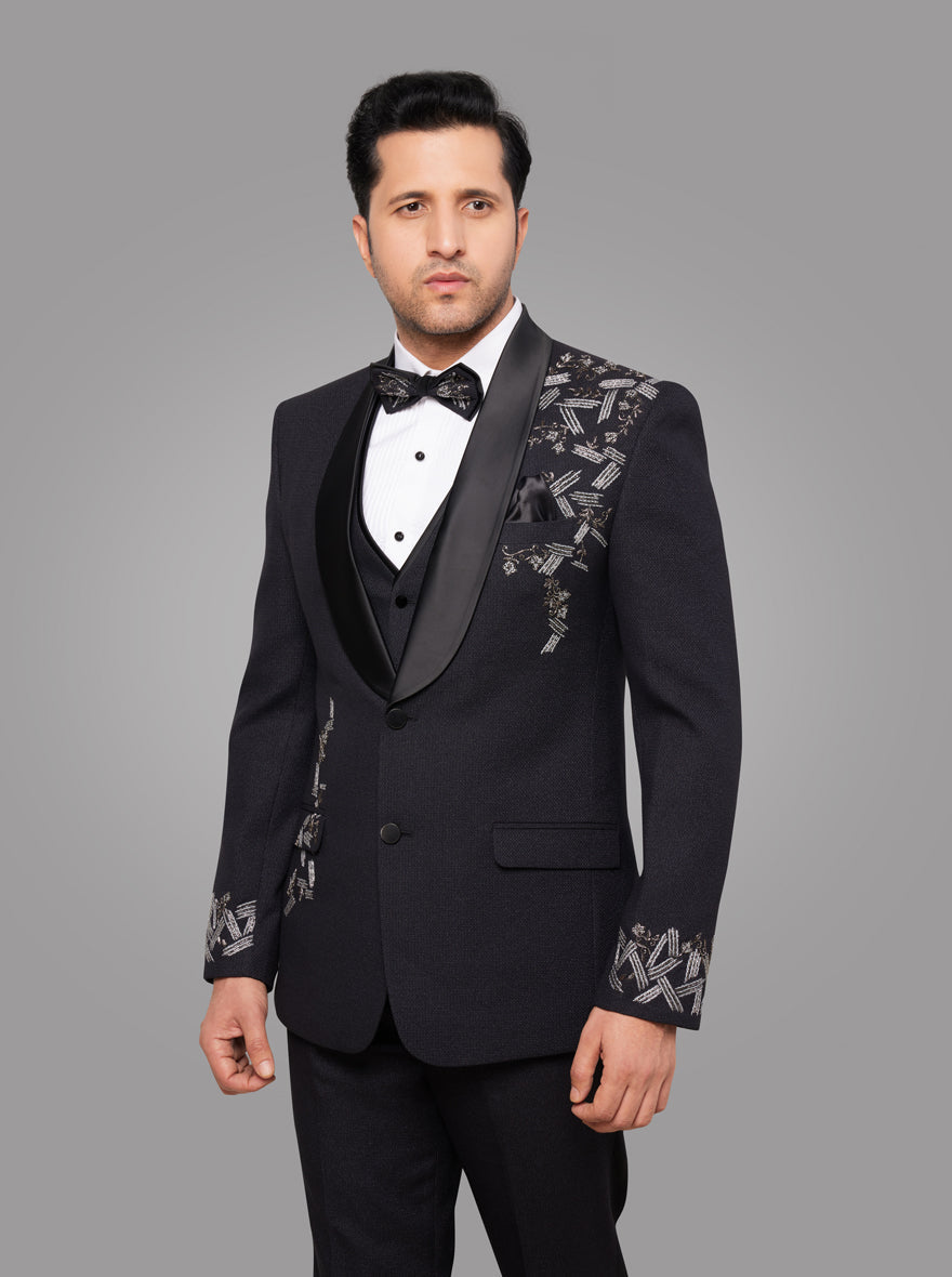 Classic black suit with premium jute blend fabric and beautiful embroidery details, ideal for weddings and upscale events.