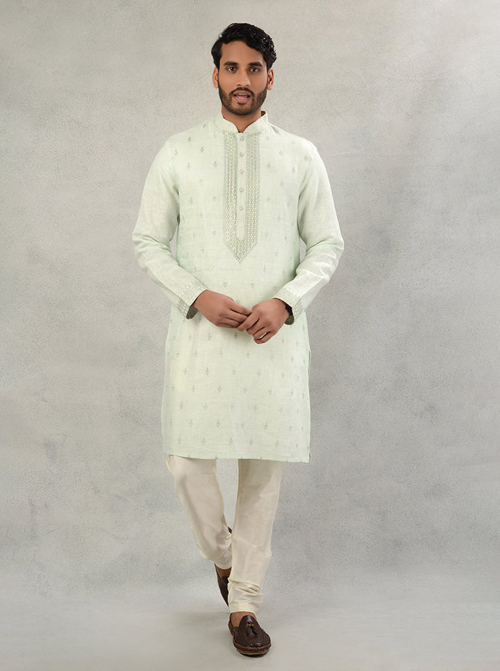 This stylish Pista Green Linen Kurta Pajama is perfect for elevating your look during traditional celebrations.