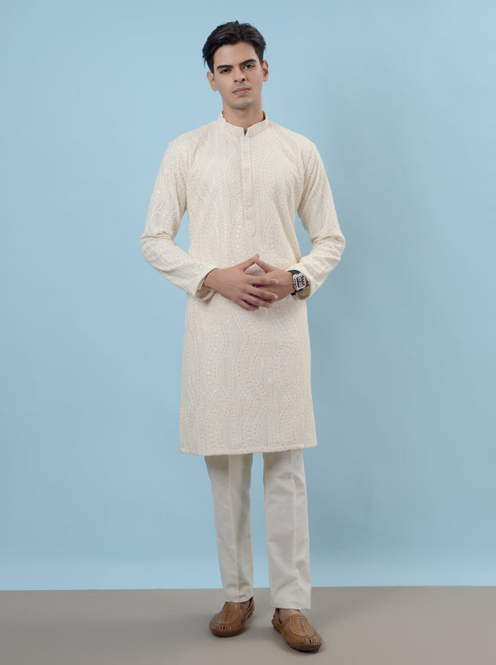 Unique cream silk kurta pajama designed for men, ideal for traditional gatherings and celebrations.