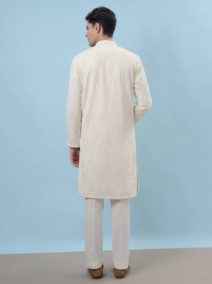 Celebrate in style with our cream silk kurta pajama set, crafted for comfort and sophistication.