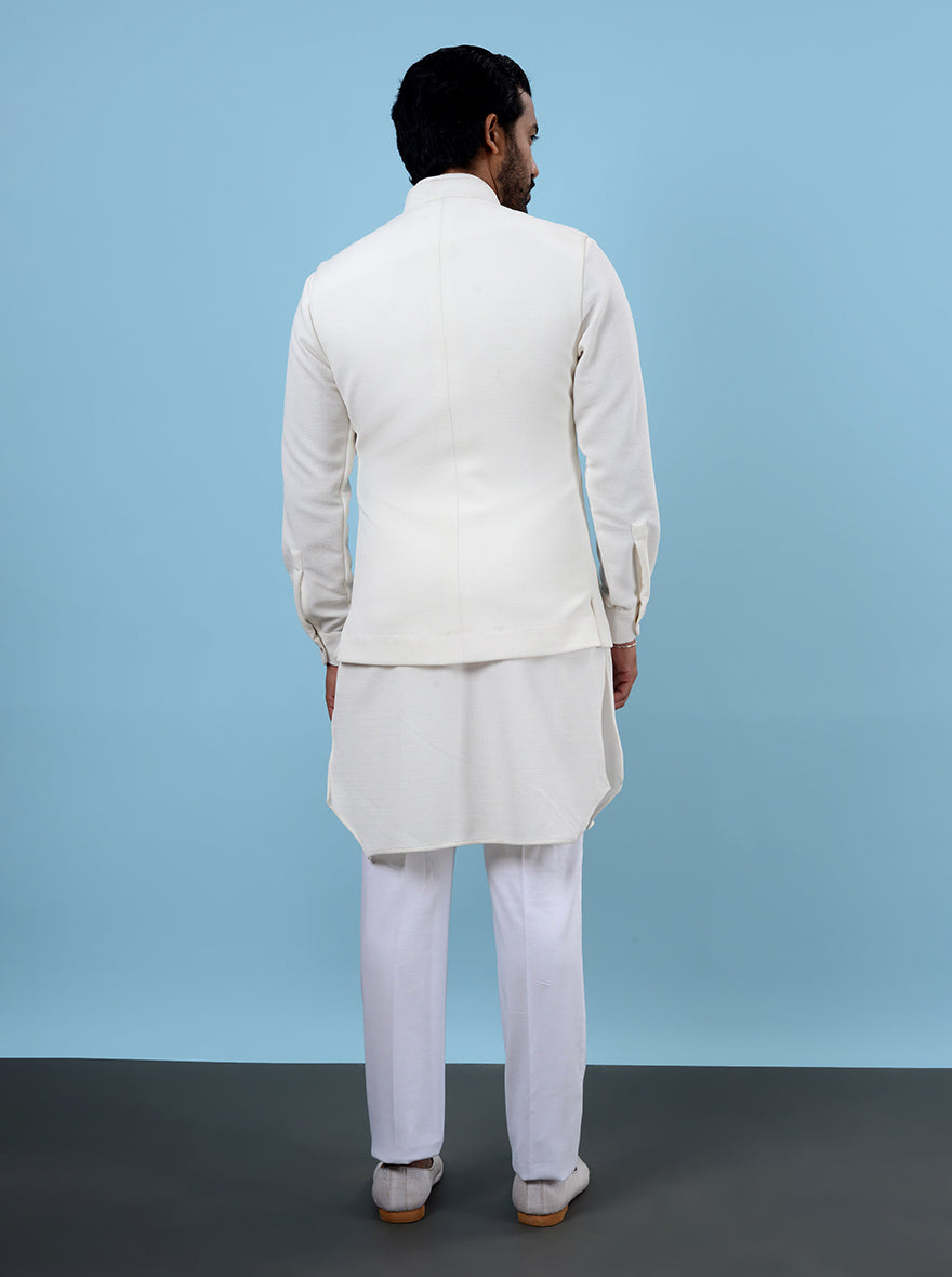 Comfortable cream kurta set for pooja, made from silk stretch fabric.