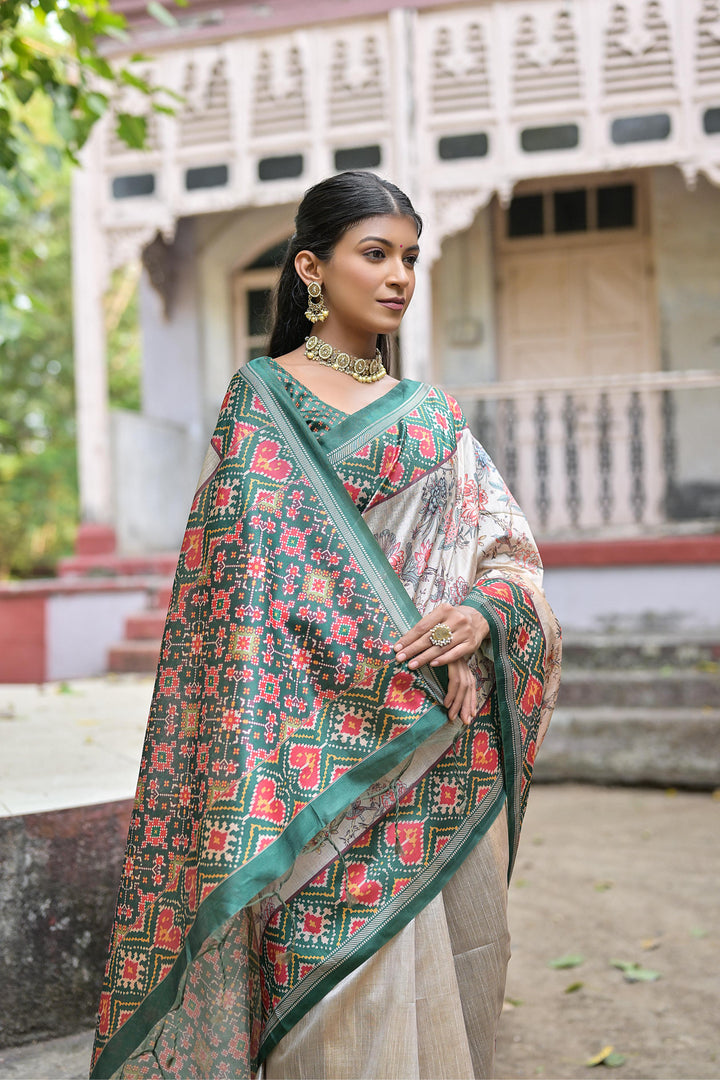 Stunning Tussar silk saree with traditional Patola print and floral design