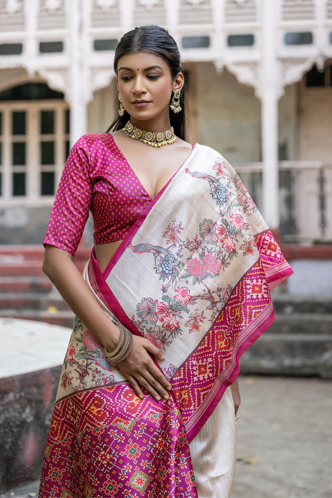 Traditional Tussar silk saree featuring floral and Patola designs