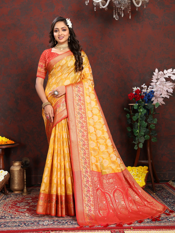 Yellow Meenakari Organza silk saree with intricate weaving, ideal for festive occasions.