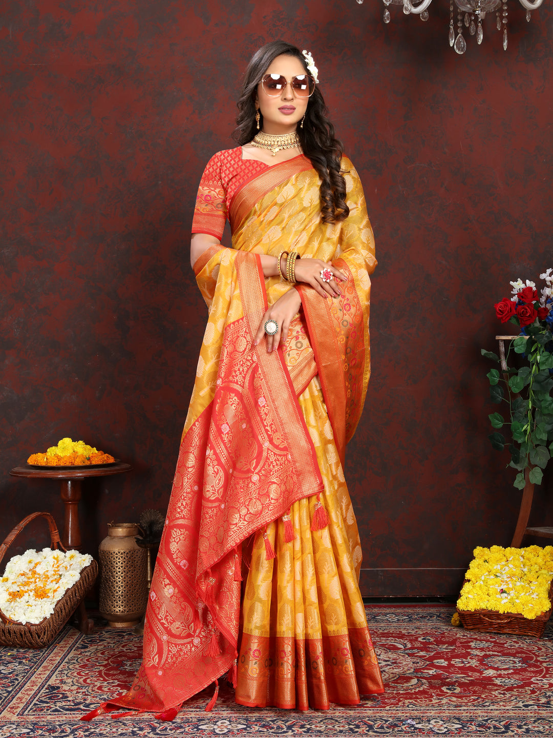 Elegant yellow Organza silk saree with luxurious Meenakari patterns, perfect for weddings.