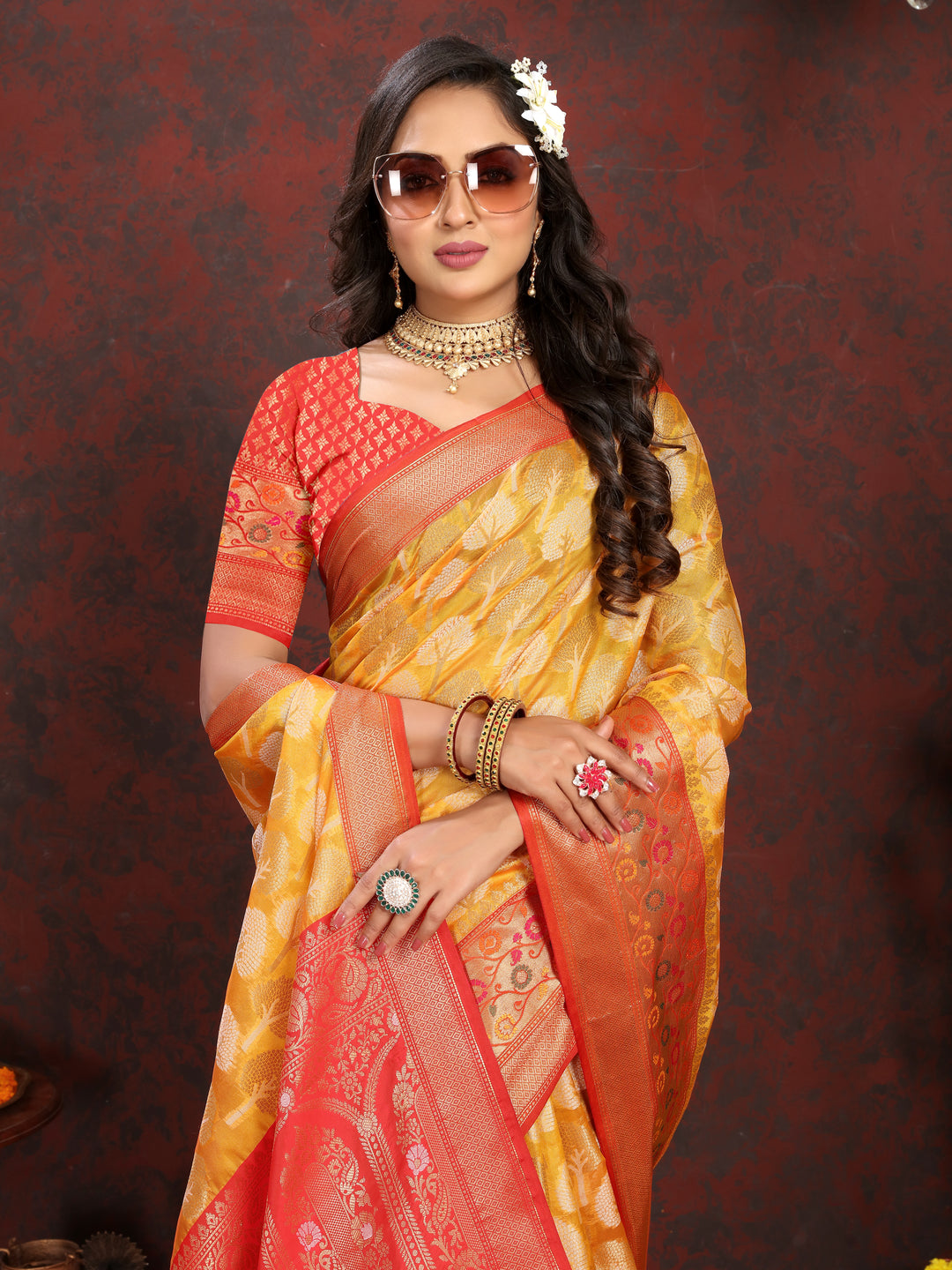 Designer yellow Meenakari Organza silk saree featuring intricate artistry, ideal for cultural gatherings.