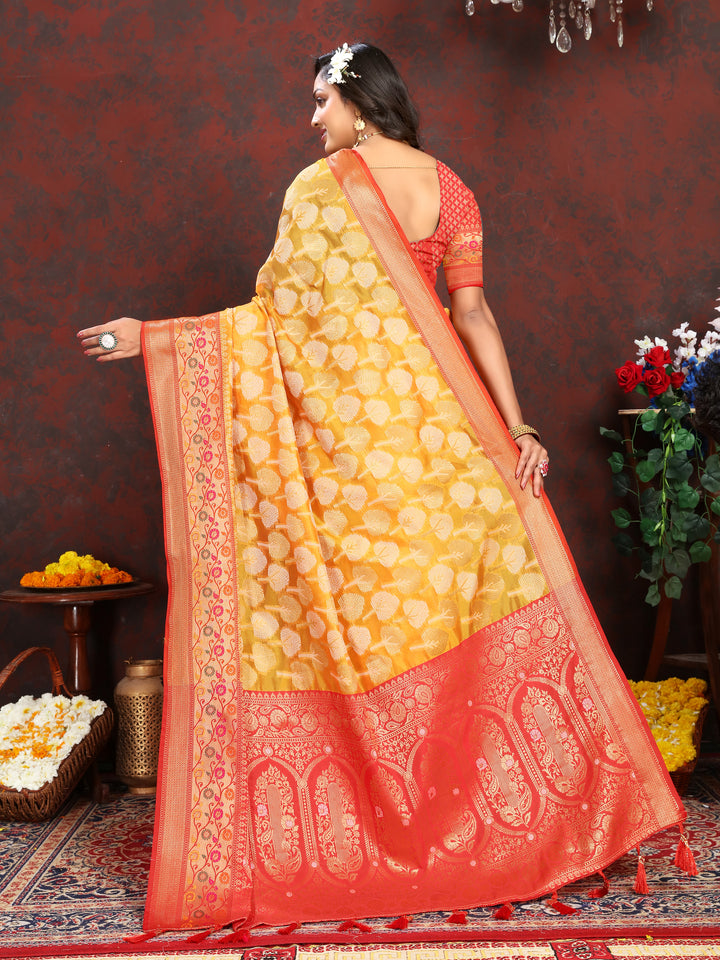 Classic yellow Organza silk saree with rich Meenakari details, perfect for Indian celebrations.