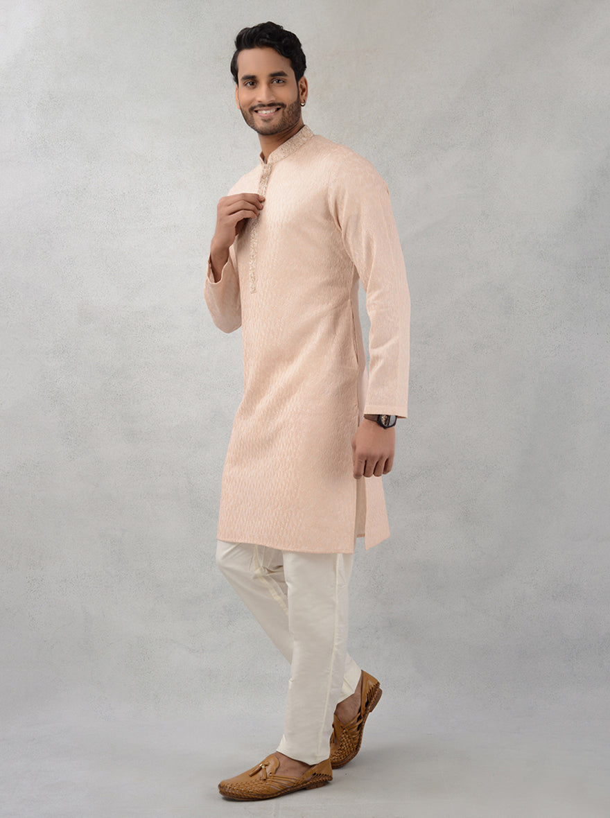 Peach kurta pajama combines traditional charm with modern elegance for special events.