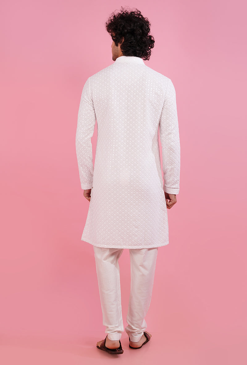 Stand out at celebrations with this embroidered white silk blend kurta pajama for men in the USA.