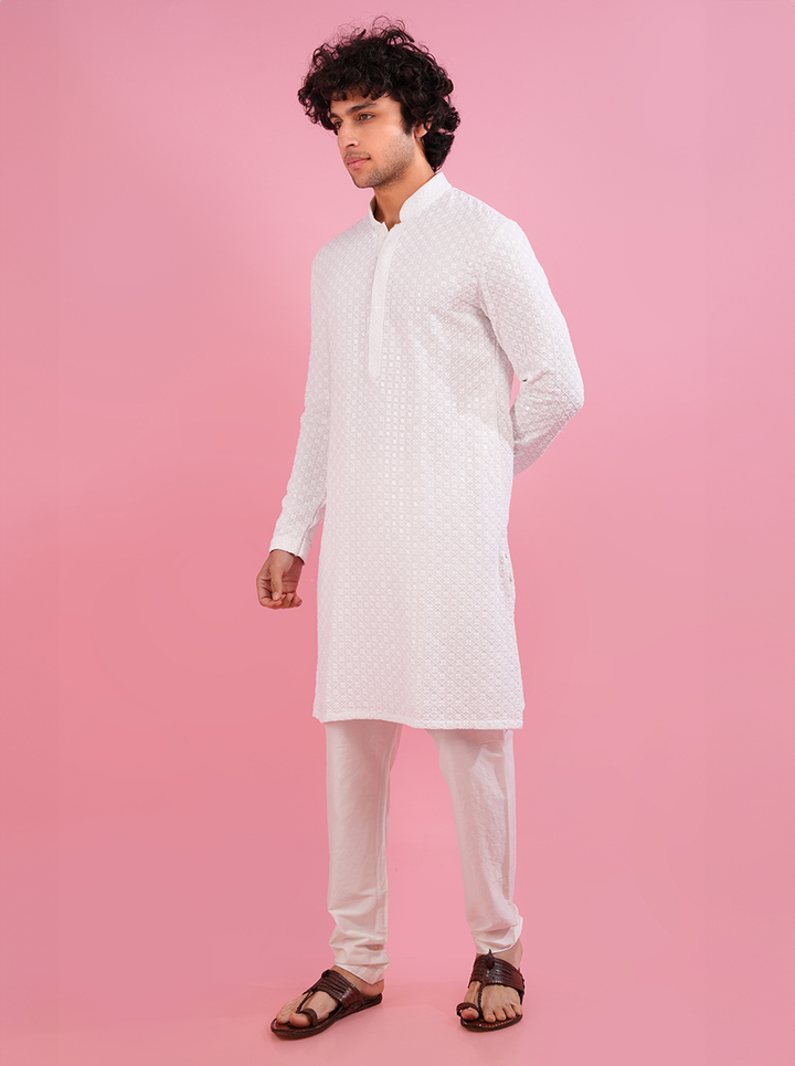 Enhance your traditional look with this elegant white silk blend kurta pajama, designed for special events in the USA.