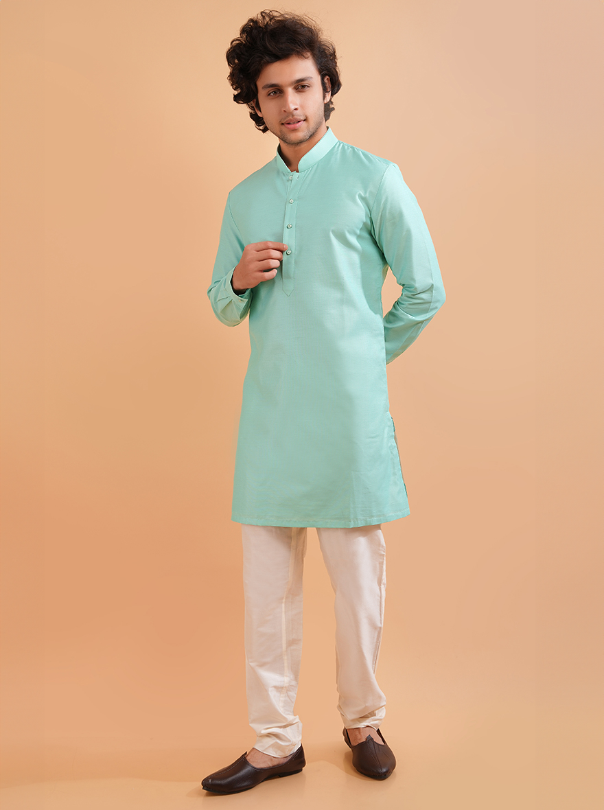 Make a fashion statement in the USA with this designer Aqua Blue Silk Blend Kurta Pajama.