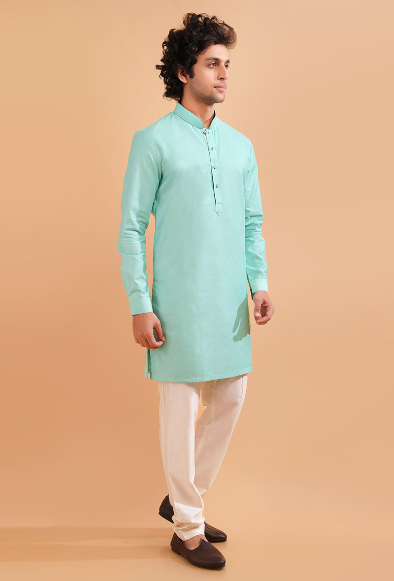 Aqua blue silk blend kurta pajama set with fine detailing, perfect for cultural celebrations.