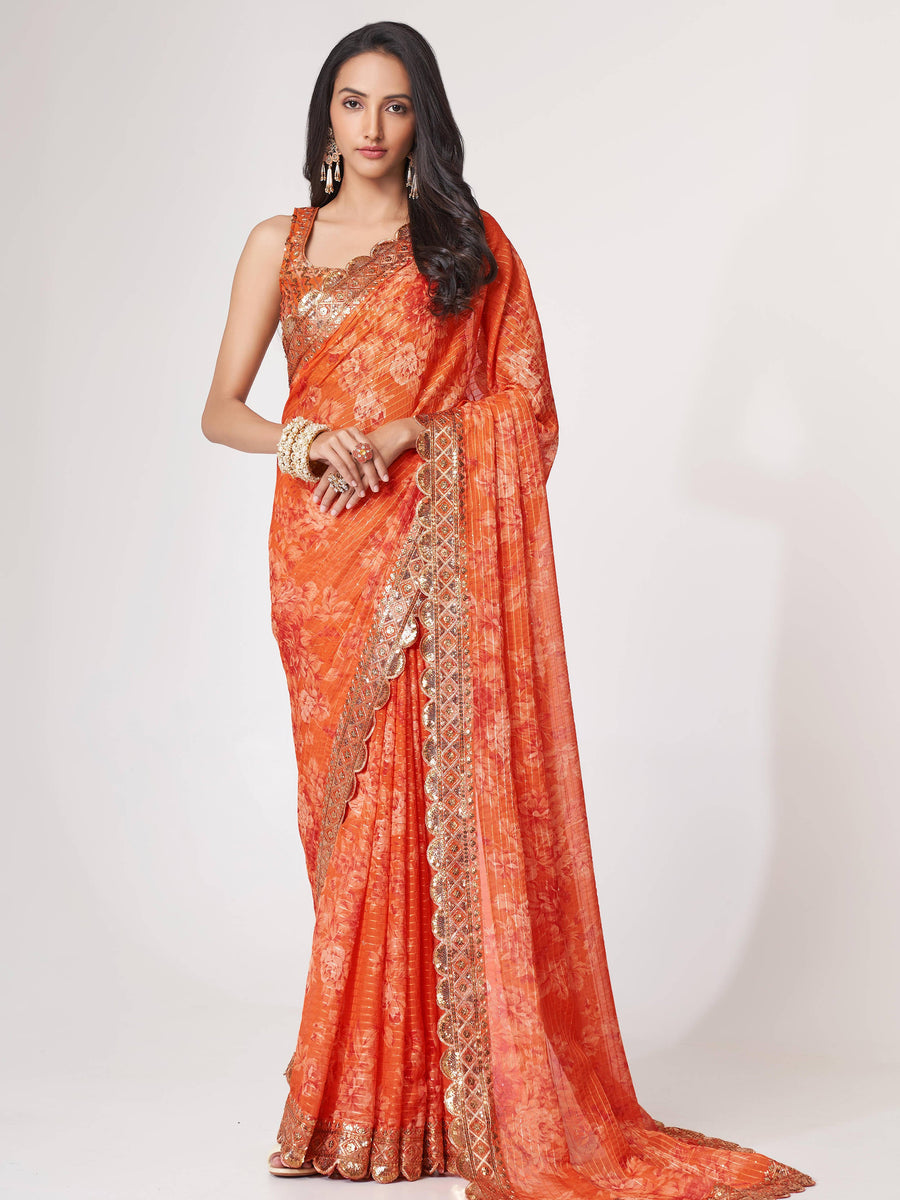 Orange luxurious fabric saree crafted for elegance and style.