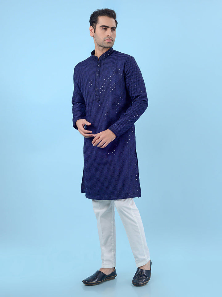 Elegant blue silk kurta pajama for men, crafted with sequins work for a refined ethnic style.