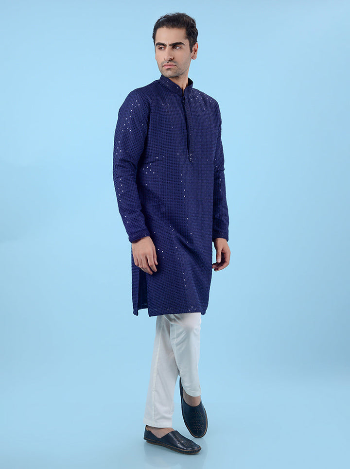 Stylish blue silk kurta pajama for men, embellished with sequins for a unique ethnic wear design.