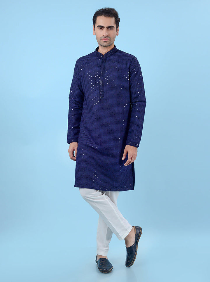 Men's blue kurta pajama set in silk, with sequins work for a glamorous and festive ethnic style.