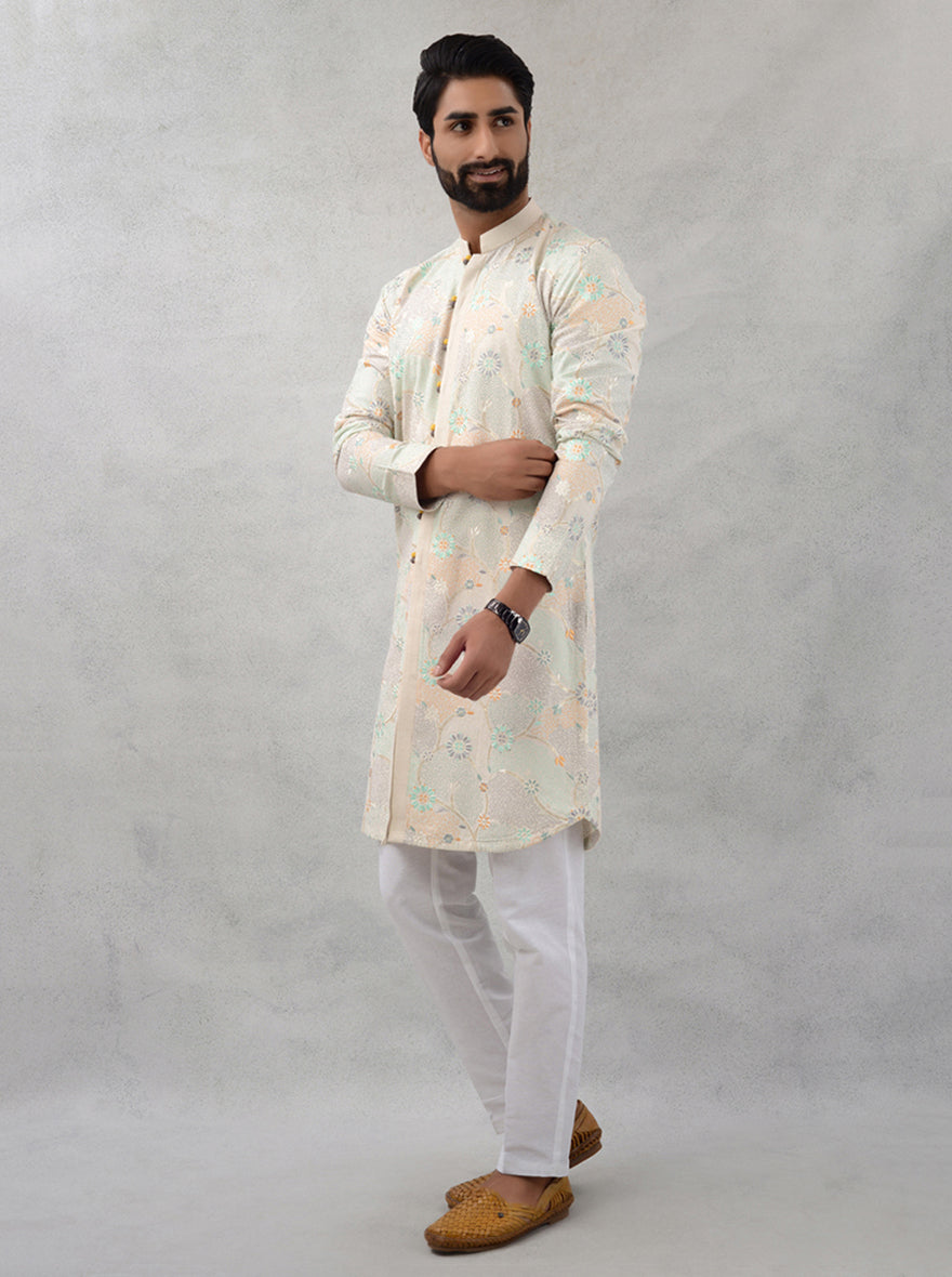 Classic beige kurta pajama set with green accents, perfect for USA festivals