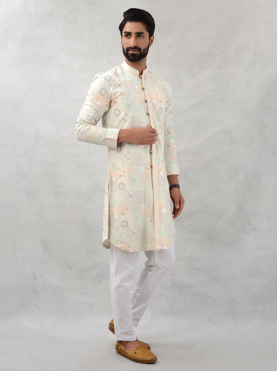 Men’s beige kurta pajama set with embroidery, designed for USA festivals