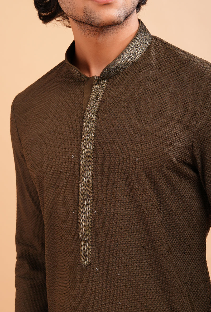 Stylish brown kurta pajama set for men, ideal for traditional events and gatherings.