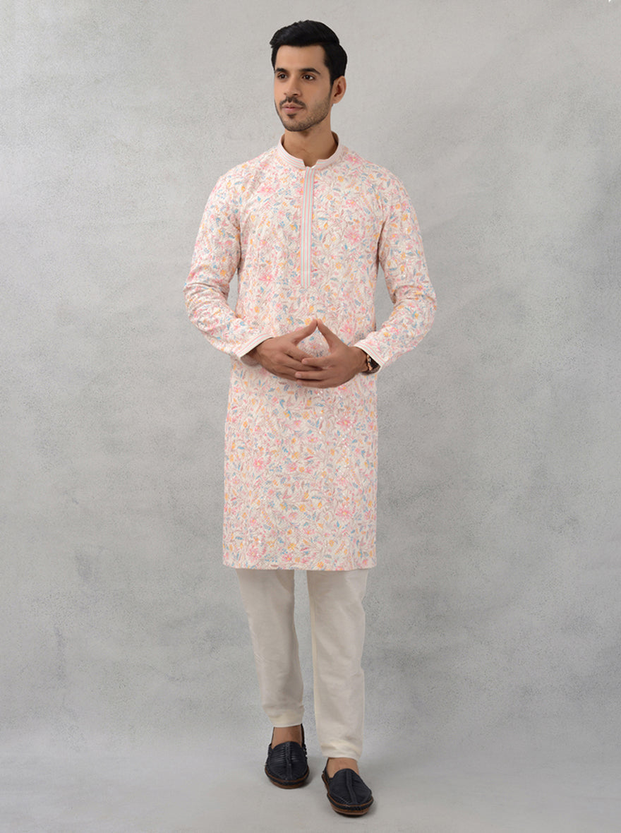 Elegant cream kurta featuring exquisite embroidery details.