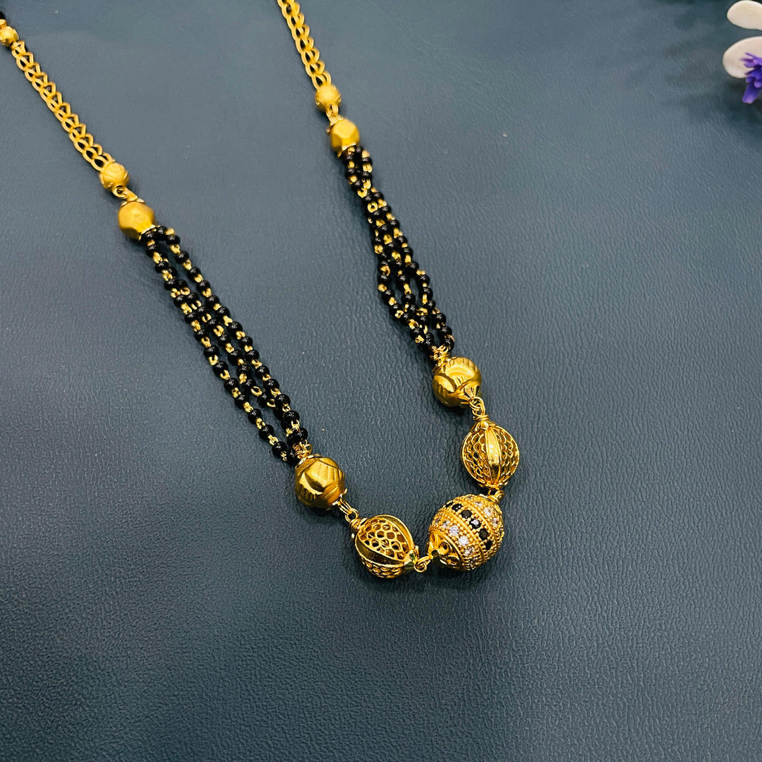 Stylish black and gold mangalsutra, crafted in gold alloy, ideal traditional necklace.