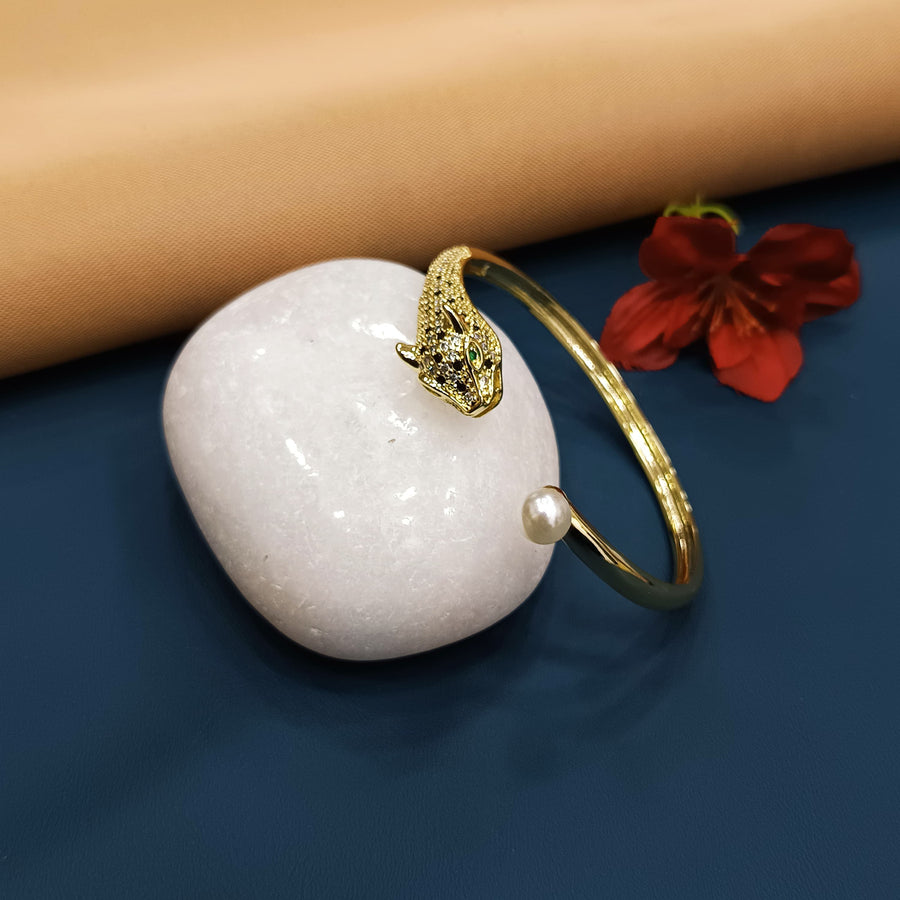 Sophisticated golden bracelet with minimalist elegance.