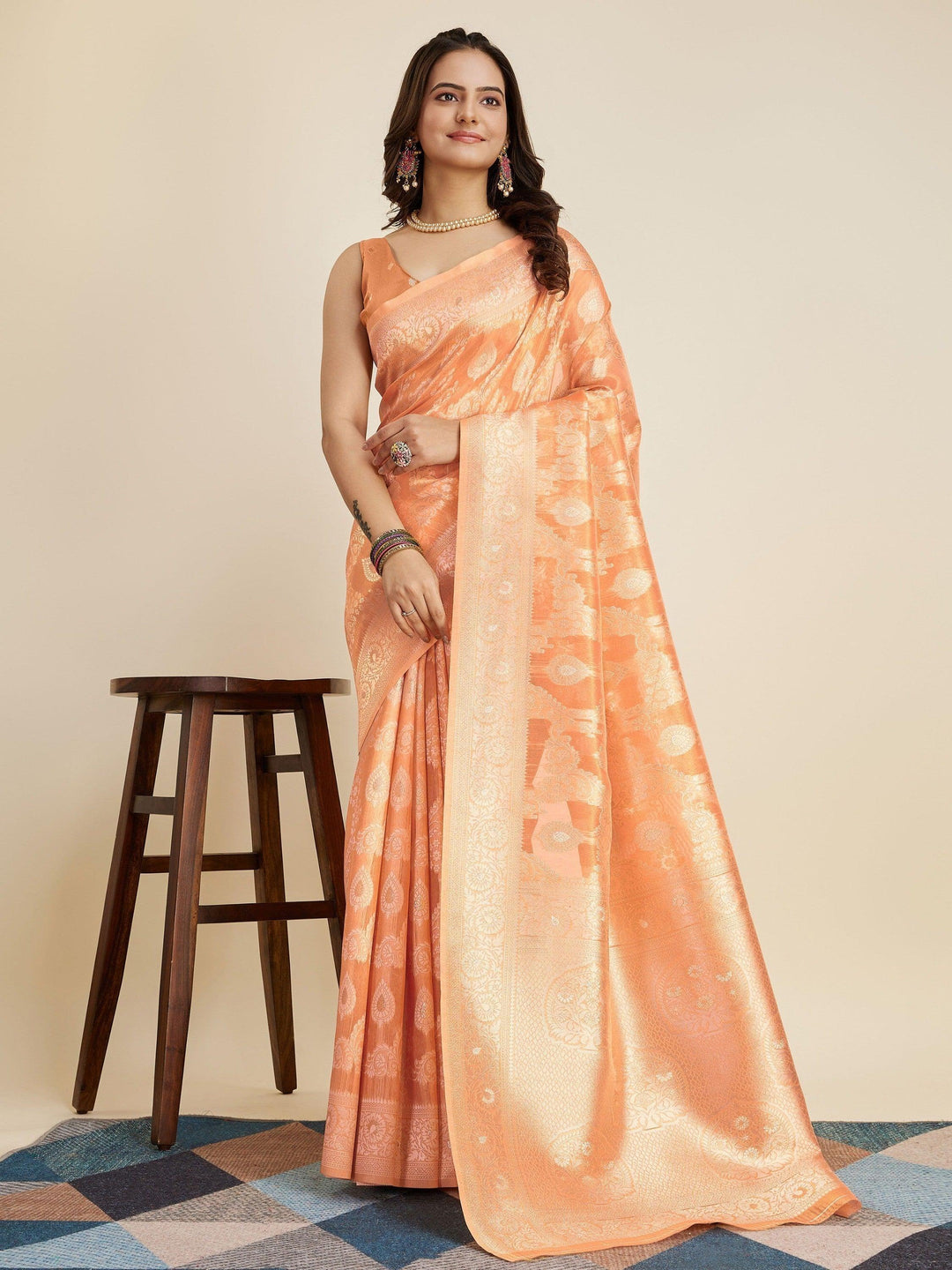 Orange silk saree crafted for elegance and style.