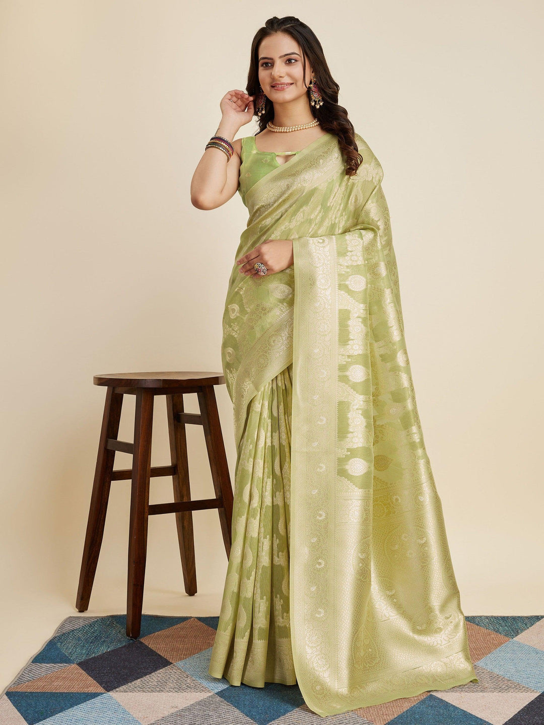 Green silk saree crafted for elegance and style.