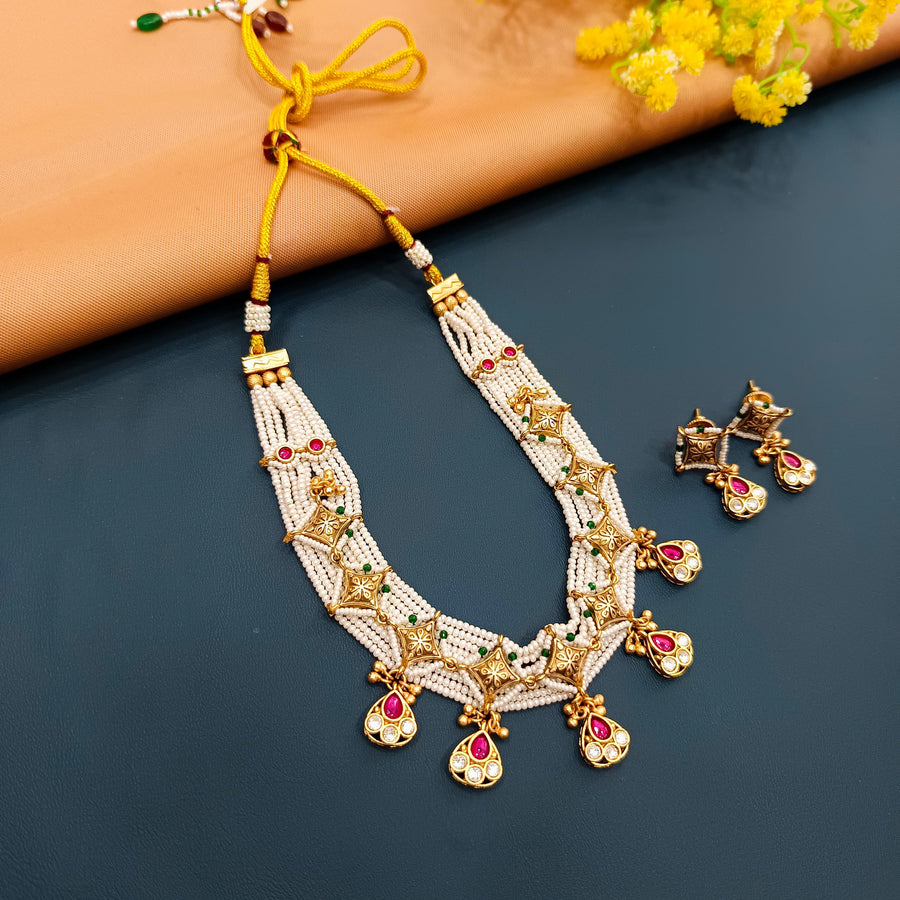 Intricate Indian choker in gold-tone metal, perfect for adding elegance to cultural attire.