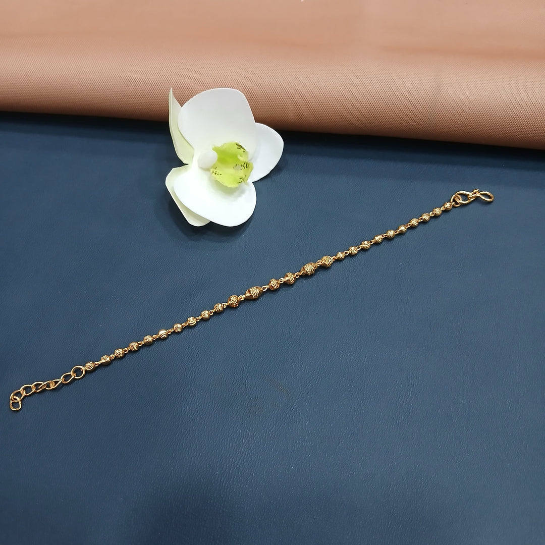 Elegant golden bracelet with a stylish rope twist, ideal for formal events.