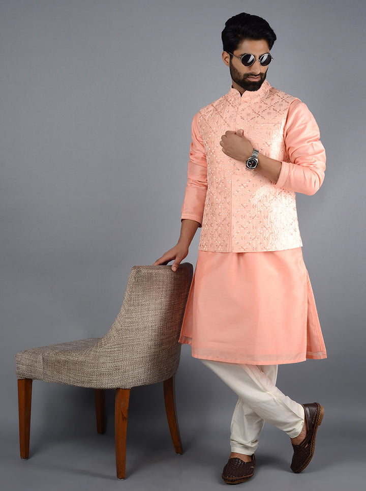 Intricate detailing on this pink Bandhgala jacket adds sophistication to your ethnic wear for any occasion.